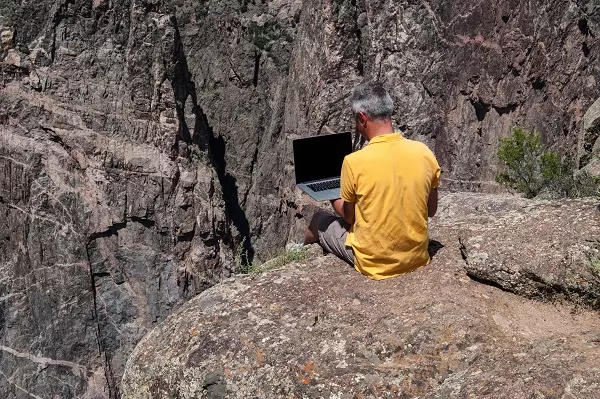 Man working on a cliff